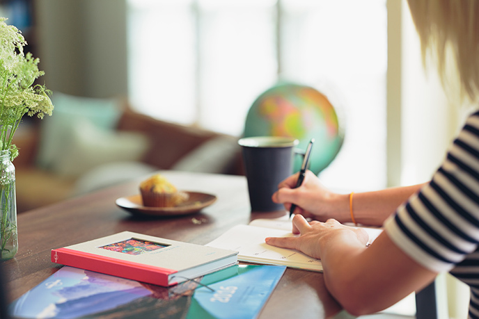 Professional Woman Writing on Desk